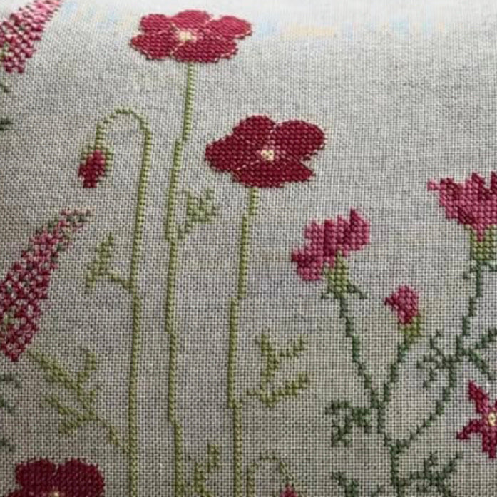 Close up av red flower broderi